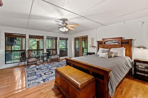 a bedroom with a bed and a ceiling fan at Big Bear Falls in Ellijay