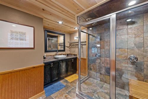 a bathroom with a shower and a sink at Big Bear Falls in Ellijay