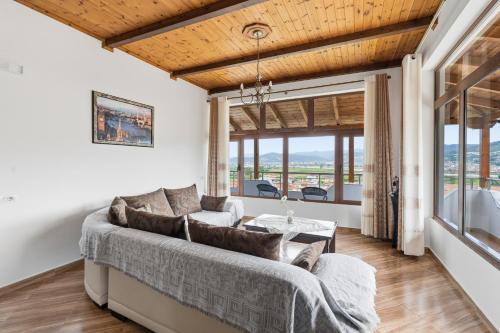 a living room with a couch and a table at Vila Palma in Berat