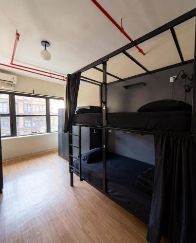 a room with three bunk beds in it at Nap York Central Park Sleep Station in New York