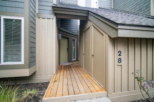 an overhang on a house with a wooden deck at 28 Quelah Condo in Sunriver