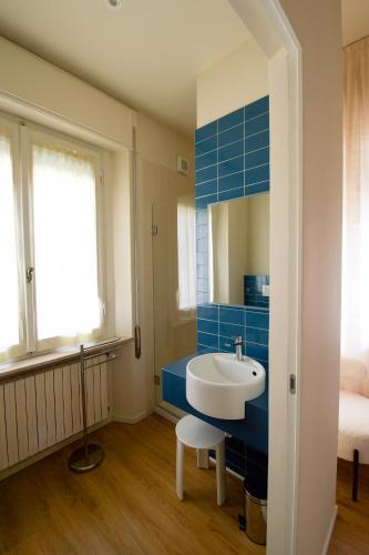 a bathroom with a sink and a mirror at Villa alle Mura in Lucca