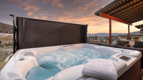 a jacuzzi tub sitting on top of a balcony at Allegro Peak in Steamboat Springs