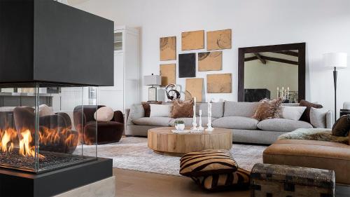 a living room with a couch and a fireplace at Allegro Peak in Steamboat Springs
