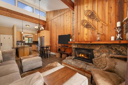 a living room with a couch and a fireplace at Beaver Village Unit #2031 in Winter Park