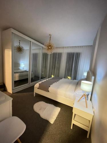 a bedroom with a large bed and a large window at قرية الراحه مرسى زايد in Al Burj
