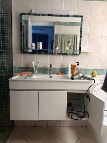 a bathroom with a sink and a mirror at Rosa dei venti 3 in Santa Maria