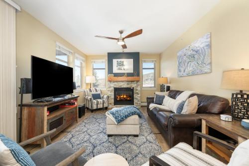a living room with a couch and a tv at Fraser Crossing 3302 in Winter Park