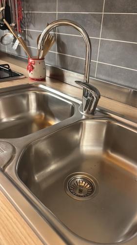 a stainless steel sink in a kitchen with at Casa Candiotty Lake & Mountain in Endine Gaiano