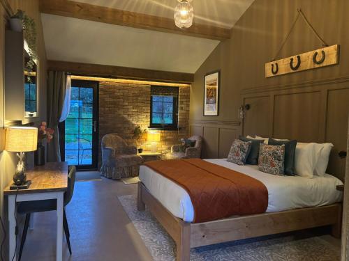 a bedroom with a large bed in a room at Accommodation Bristol Airport in Redhill