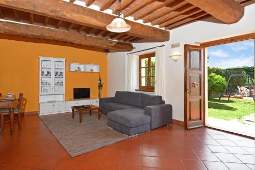 a living room with a couch and a table at Casa Sofi - Happy Rentals in Monticiano