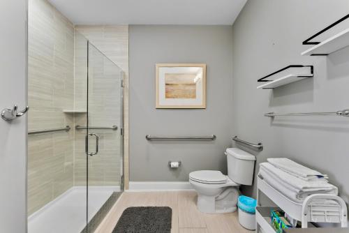 a bathroom with a glass shower and a toilet at 8609 Landis Ave, Condo 201 in Sea Isle City