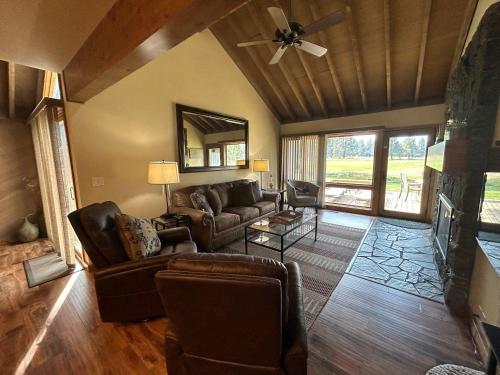 a living room with a couch and a fireplace at 32 Meadow House in Sunriver