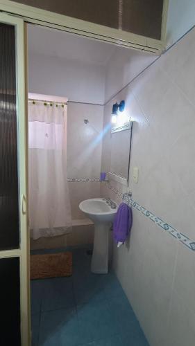 a bathroom with a sink and a mirror and a shower at Quimelco casa de campo in La Granja