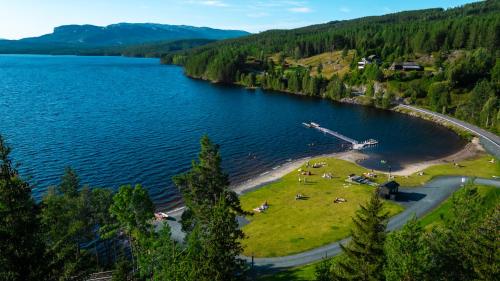 an aerial view of a lake with a boat in the water at Bolkesjø Gaard in Notodden