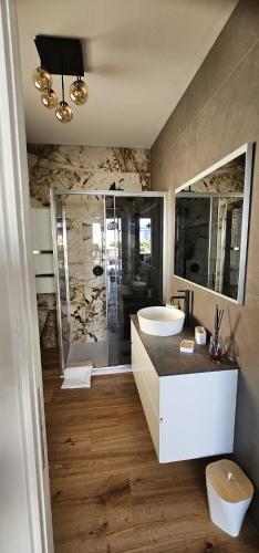 a bathroom with a toilet and a sink and a shower at Cedrino suite apartment in Cagliari