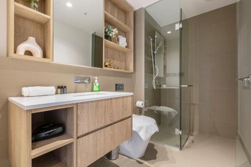 a bathroom with a sink and a shower at Spencer on Rock in Melbourne