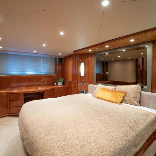 a large bedroom with a large bed and a desk at The Lux Yachts - Luxury Private Yacht Experience in Helsinki