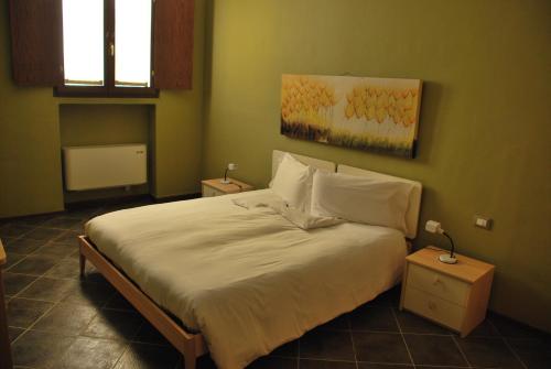 Residence Corona Grossa tesisinde bir odada yatak veya yataklar