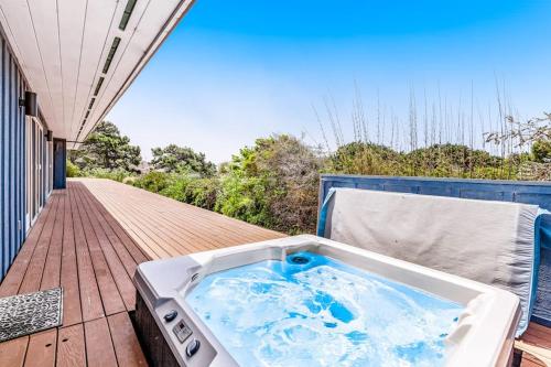 a hot tub on the deck of a house at Voyagers Paradise in Gualala