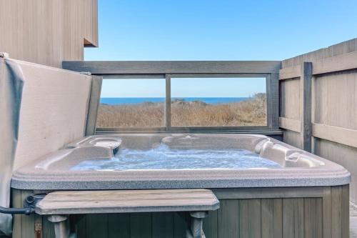 a jacuzzi tub with a view of the ocean at Del Mar Point in Sea Ranch