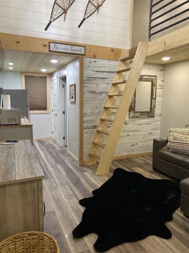 a loft office with a staircase and a living room at Catch'em AK - Bears Den in Soldotna