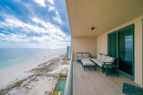 a balcony with a view of the beach at Phoenix X 1504 condo in Orange Beach