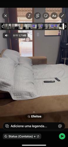 a picture of a bed in a room at Casa 2 temporada in Trindade