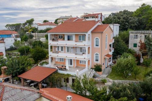 Apartments by the sea Palit, Rab - 25309