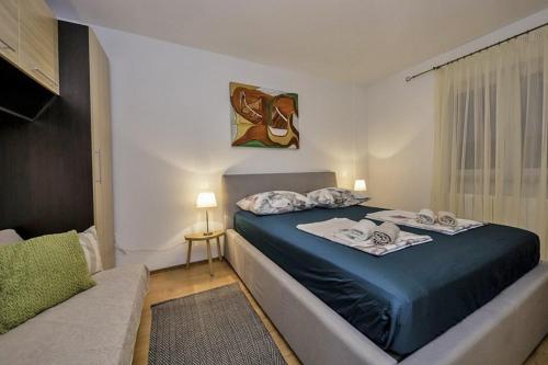 Apartments by the sea Palit, Rab - 25309