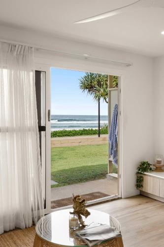 a living room with a view of the ocean at Little Waves Tugun in Gold Coast