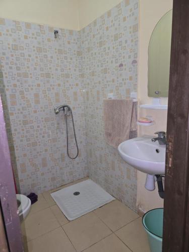 a bathroom with a shower and a sink at Asrati in Ifrane