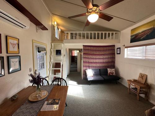 a living room with a couch and a table at The Lake House in Weed