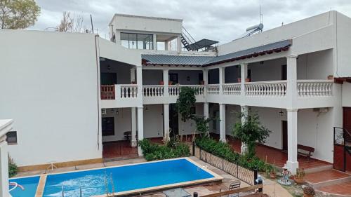 an aerial view of a house with a swimming pool at Hotel Maria Cafayate in San Carlos