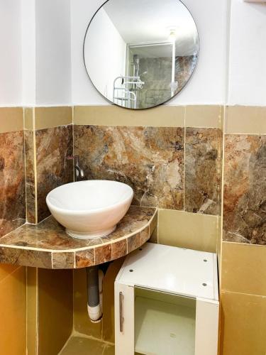 a bathroom with a sink and a mirror at Nice Apartment in Urubamba in Urubamba