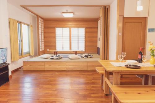a room with a bed in the middle of a room at 民泊八のや in Hachioji