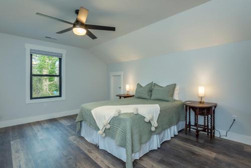 a bedroom with a bed and a ceiling fan at Roam Inn in Black Mountain