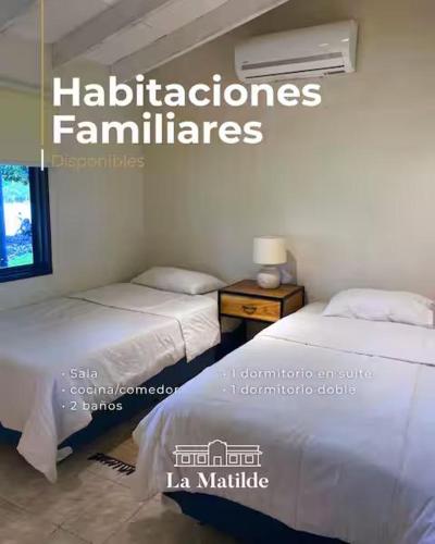 two beds in a room with at La Matilde Lodge in San Bernardino