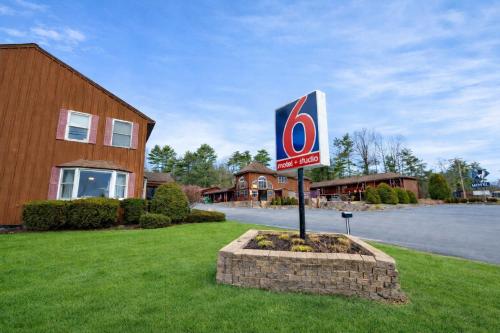 a no parking sign in front of a building at Motel 6 Lake George, NY Adirondacks in Lake George
