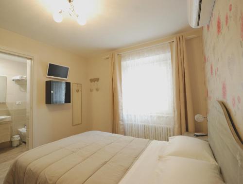 Postel nebo postele na pokoji v ubytování B&B Incanto sotto il mare