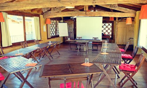 a group of tables and chairs in a room at Oasi Galbusera Bianca in Rovagnate
