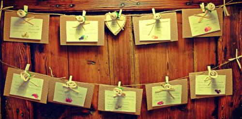 a wooden wall with clocks hanging on it at Oasi Galbusera Bianca in Rovagnate