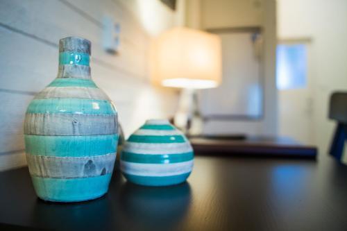 two vases sitting on top of a table at Sjögestad Motell in Vikingstad