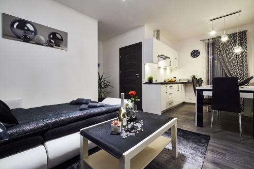 a living room with a couch and a table at Apartament Perła Pienin in Dębno
