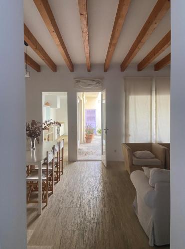a living room with a table and a couch at Puerto de Cala Ratjada in Cala Ratjada