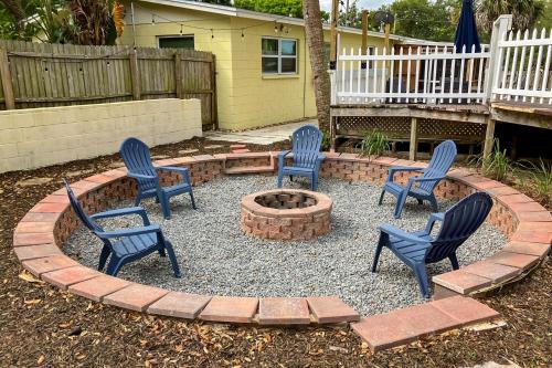four chairs and a fire pit in a yard at 2403 Auburn Dr in Cocoa