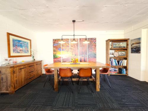 a dining room with a wooden table and chairs at Spacious Guest Room 7 Sleeps 5 Near Shops with Free Parking in Highett