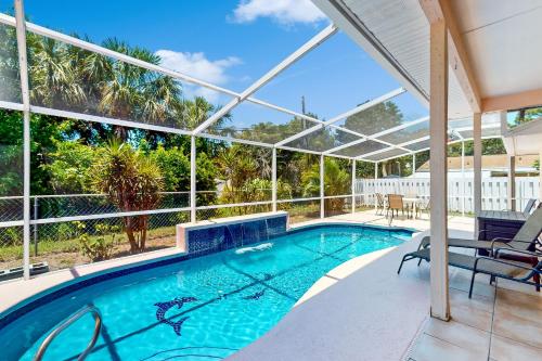 a swimming pool with a view of a house at 1295 Barber St in Sebastian