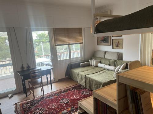 a living room with a couch and a table at Beachfront Apprtment on Athens Riviera in Saronida