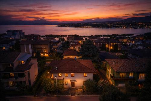 a view of a city at night at Villa 70 in Peschiera del Garda